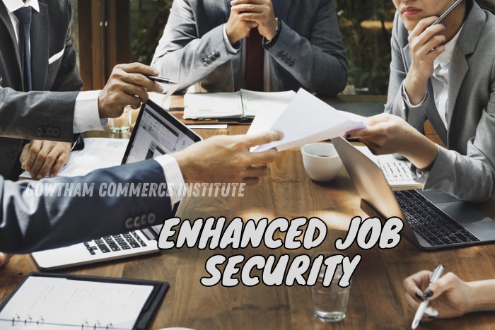 Busy meeting scene with professionals exchanging documents around a table, highlighting the theme of 'Enhanced Job Security' at Gowtham Commerce Institute in Peelamedu, Coimbatore