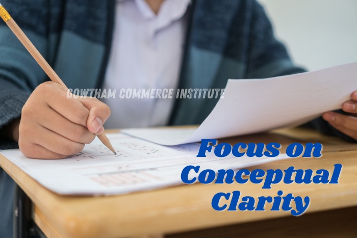 Student practicing exam paper with focus on conceptual clarity at Gowtham Commerce Institute, Peelamedu, Coimbatore