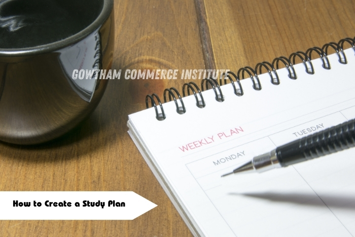 Study plan notebook with pen and coffee cup placed on table at Gowtham Commerce Institute, Peelamedu, Coimbatore